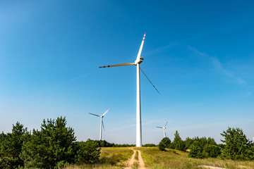 rotating blades of a windmill propeller. Wind power generation. Pure green energy.