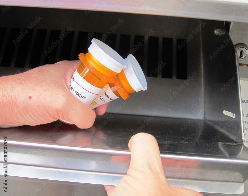 Proper disposal of unused prescription medications at a drug take back kiosk - obrazy, fototapety, plakaty 