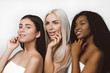 © Tetiana Moish - Three different nation girls with diversuty in skin, hair. Caucasian, African american and Asian girls cheerful emotional posing on white background,  lifestyle people concept.