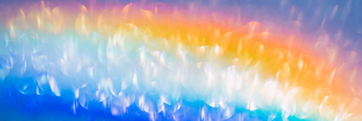 Wall Mural - iridescent holographic rainbow banner. colorful lens flare bokeh background texture