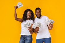 Lucky Afro Man And Woman Holding Winning Money