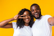 © Prostock-studio - Beautiful african american couple smiling and taking selfie