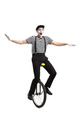 Wall Mural - Mime riding a unicycle and balancing with hands