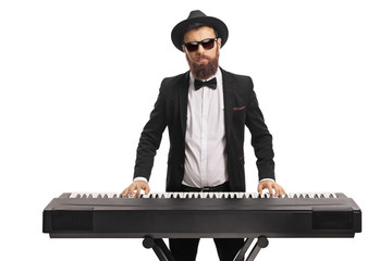 Sticker - Portrait of a male musician in a suit playing a keyboard