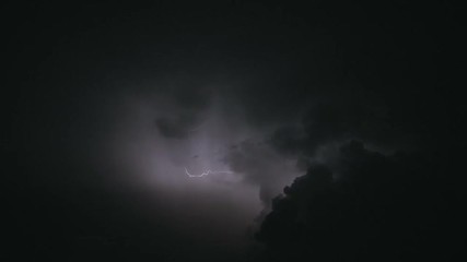 night stormy sky above city. set of beautiful lightning strikes. thunderstorm clouds. slow motion.