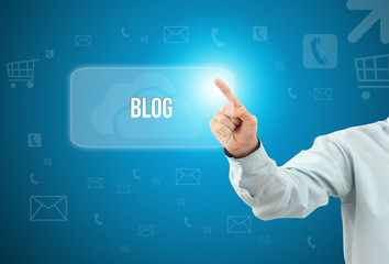 business man touch a button on an imaginary screen with text blog