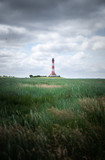 Fototapeta Natura - Lighthouse at Westerheversand in northern Germany, Europe