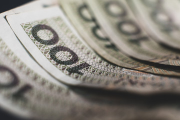 Polish Zloty banknotes (PLN) composition - Closeup on stack of 100 PLN banknotes. Macro shot. Business, economic background