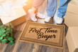 © Andy Dean - Man and Woman Unpacking Near Our First Time Buyer Welcome Mat, Moving Boxes and Plant