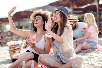 Two woman having fun on the beach