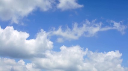 Wall Mural - Timelaps of cumulus white clouds with blue sky on a sunny day of summer. Beautiful cloudscape time lapse nature background. Cloud are moving fast-Dan