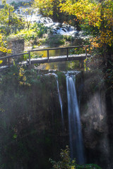 Sticker - The wooden small bridge and a waterfall