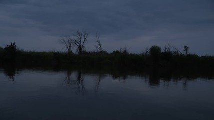 Wall Mural - Port view from a boat ride on river in Russia on a warm sunrise. Handheld shot