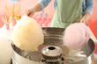 Woman making cotton candy at fair