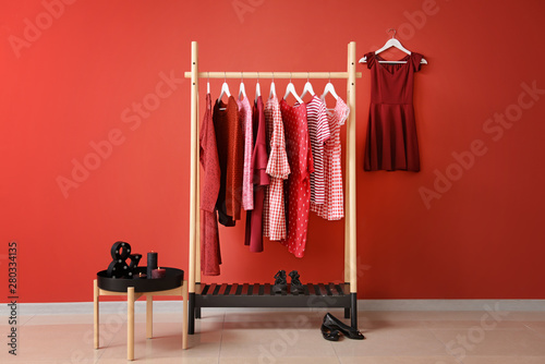 Cuadros en Lienzo Rack with hanging clothes in interior of dressing room