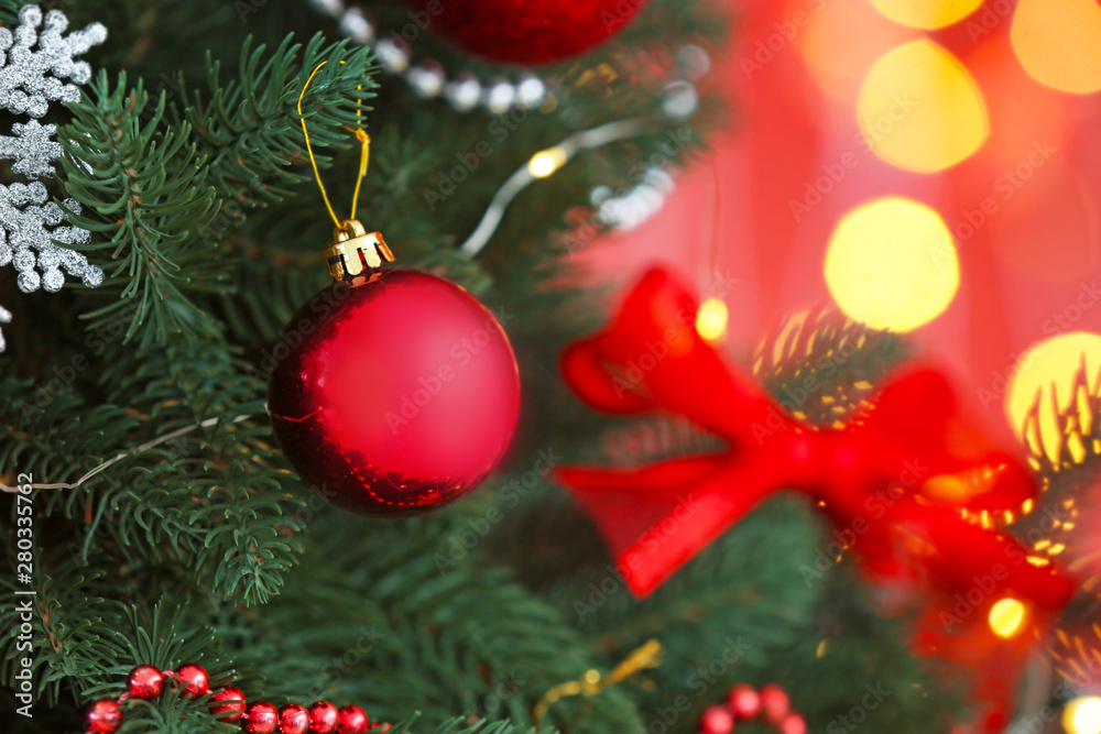 Beautiful Christmas tree against defocused lights, closeup