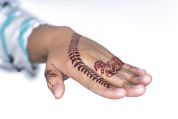 Woman Hands with black mehndi tattoo. Hands of Indian bride girl with black henna tattoos. Hand with perfect turquoise manicure and national Indian jewels. Fashion. India. Marriage traditions.