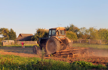 Tractor working in field