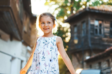 Poster - laughing girl in sunny street