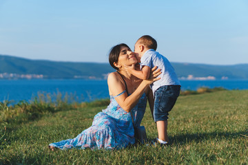 Canvas Print - son kissing mother