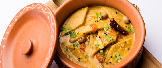 Dal Dhokli, Varan Phal or Chakolya is a gujarati, Rajasthani and maharashtrian dish made using diamond shape wheat flour cakes boiled in a dal. It's an easy one pot meal. served in a bowl.