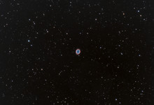 Close Up Of Ring Nebula Also Known As Messier 57 Taken In The Dark Space And Many Stars As Background.