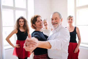 Sticker - Group of senior people in dancing class with dance teacher.