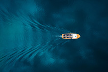 Overhead View Of Boat On Blue Water