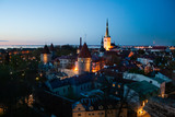 Fototapeta Miasto - Beautiful scenic aerial view of the Tallinn old town, Estonia with towers and churches, Baltic sea on the background, summer night