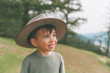 © Westend61 - Portrait of a little boy, wearing his mother's hat