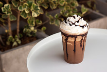 Mocha Frappe In Plastic Cup. Served With Whipping Cream And Chocolate Sauce. Freshness Drink. Favorite Caffeine Beverage Menu.