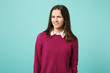 © ViDi Studio - Young fun sad upset perplexed disturb brunette woman girl in red casual clothes posing isolated on blue wall background studio portrait. People sincere emotions lifestyle concept. Mock up copy space.