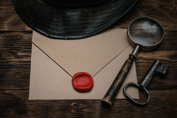 Wall Mural - top secret letter in envelope on a wooden table of secret service agent background.