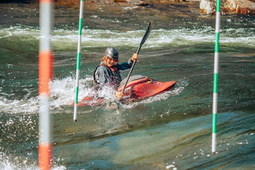 Wall Mural - Kayak man runs extreme sports track in mountain river