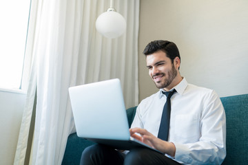 Wall Mural - Professional Using Laptop In Hotel Room