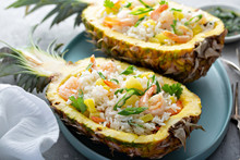 Shrimp Rice With Green Onions Served In Pineapple Boats