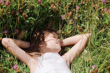 girl lying in the grass