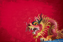 Red Big Dragon Statue On Red Texture Background .