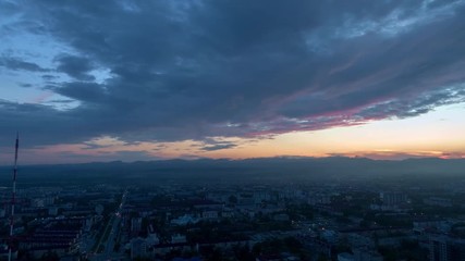 Wall Mural - aerial timelapse of a sunset cityview, yuzhno-sakhalinsk in russia