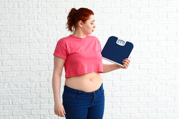 Sticker - Overweight woman with scales on white background. Weight loss concept