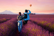 Asian couple travel in lavender field