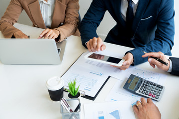 Wall Mural - Business People Talking Discussing with coworker planning analyzing financial document data charts and graphs in Meeting and  successful teamwork Concept.