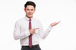 © Bangkok Click Studio - Asian businessman standing and point his hands..