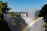 Fototapeta Nowy Jork - picture of the Victoria Falls and a rainbow while beautiful sunlight