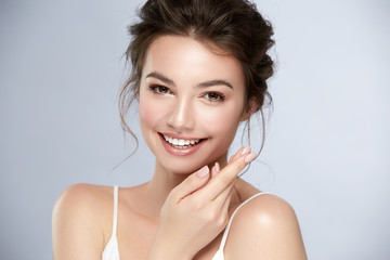 model with perfect smile and beautiful face isolated on grey
