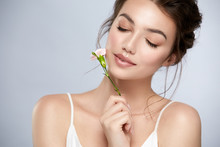 Cute Girl With Perfect Skin And White Flower Near Face Closed Eyes