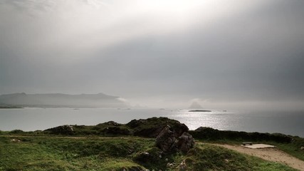 Canvas Print - Clouds moving over Arctic ocean and Kleivodden rest stop area viewpoint Andoya island Vesteralen Norway. Time lapse