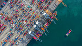 Aerial view cargo ship terminal, Unloading crane of cargo ship terminal, Aerial view industrial port with containers and container ship.