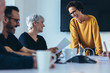 © Jacob Lund - Businesspeople smiling during a meeting