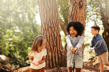 Poster - Group of kids having fun in forest